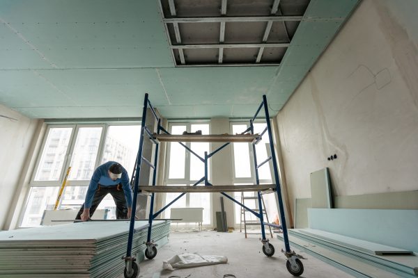 Construction worker installation ceiling work. High quality photo